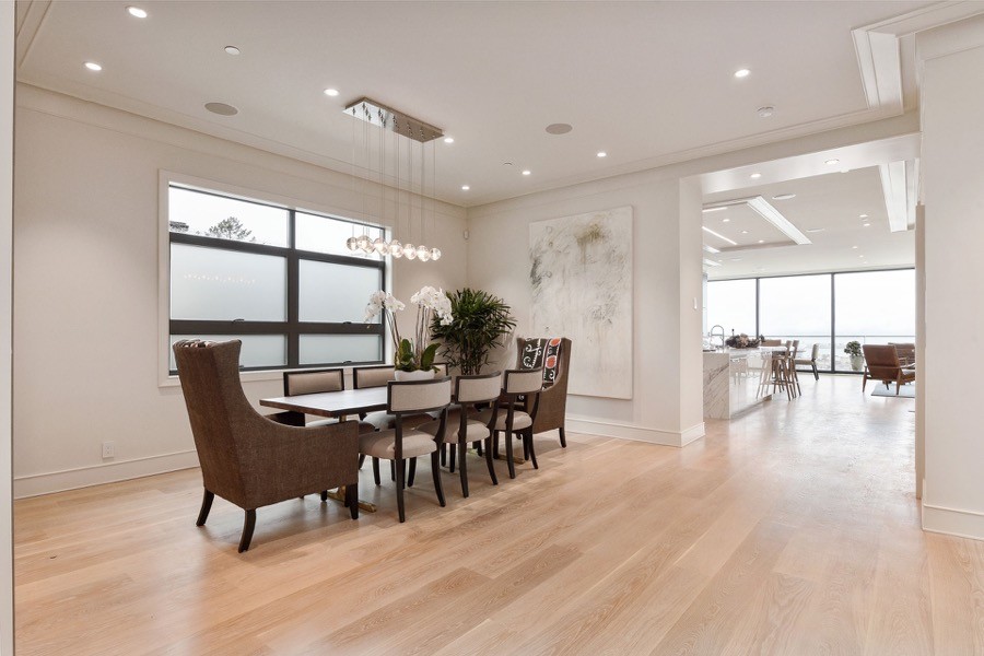 Broadway Large Open Access Dining Room With Overhead Lighting, Table And Chairs, And Natural Hardwood Floors