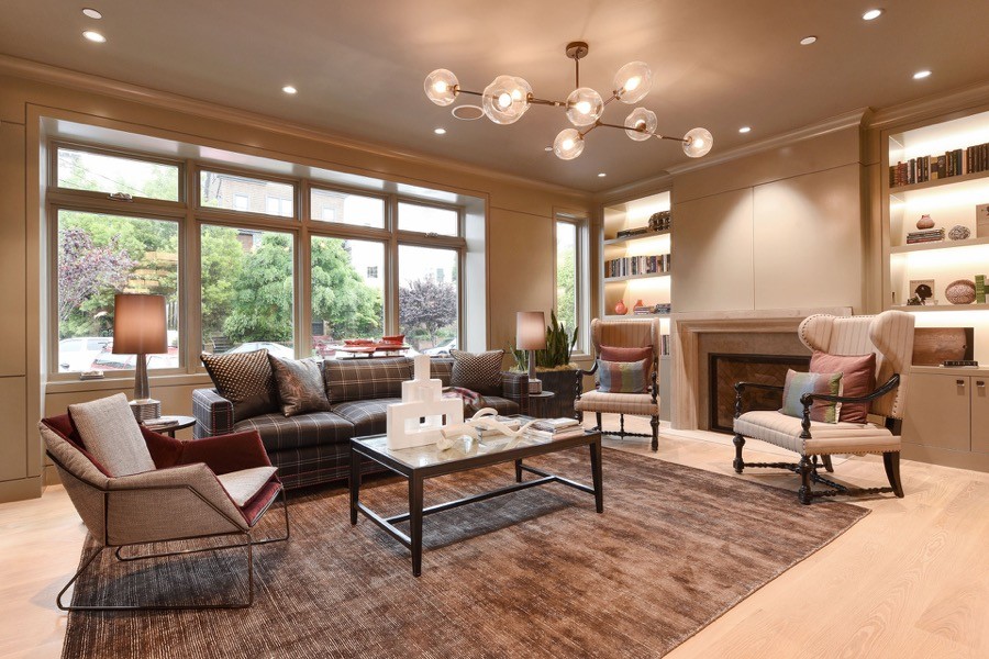 Broadway Open Living Room With Large Windows, Couch, Chairs And Coffee Table