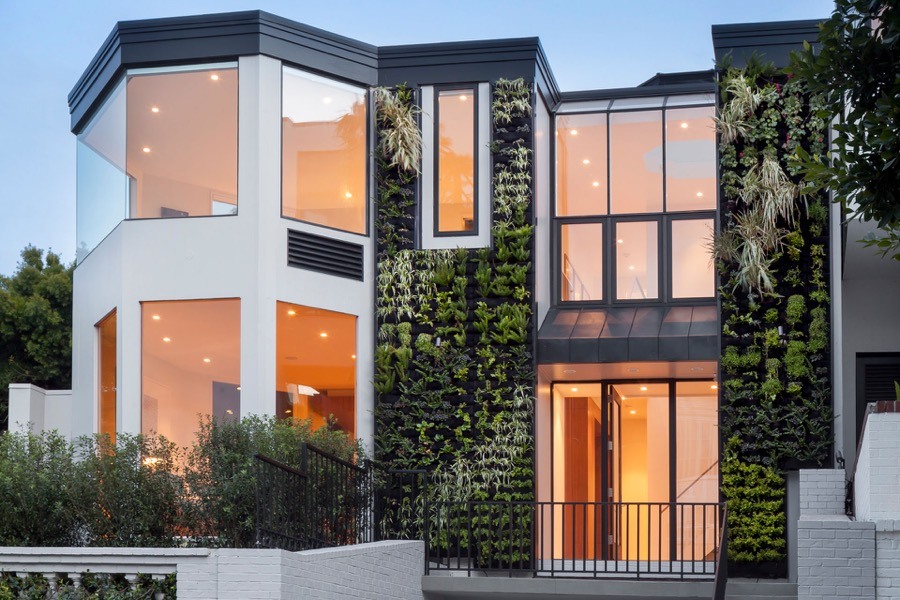Broadway White Modern Exterior With Green Walls And Large Windows Providing Natural Light