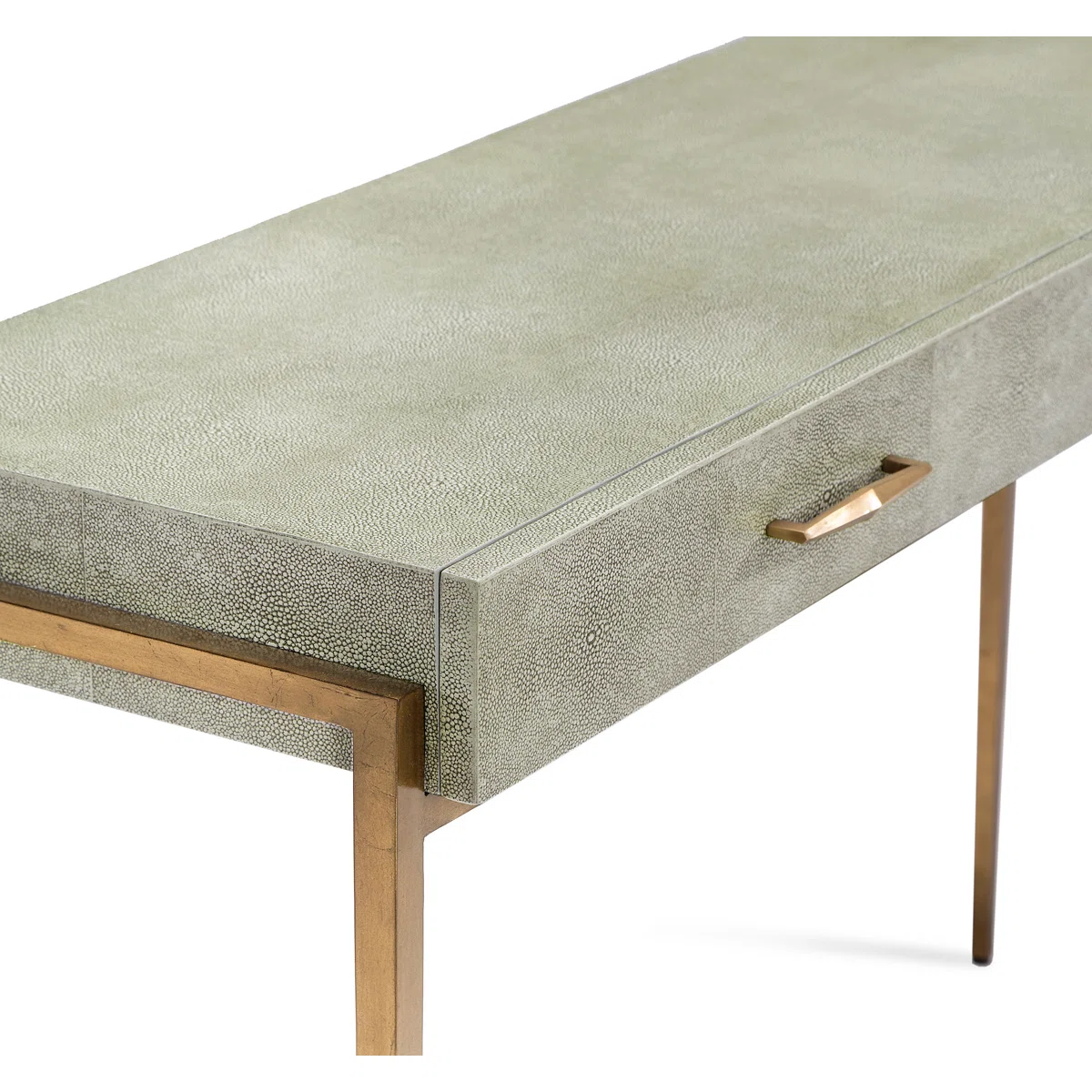 A modern console table with a textured light gray surface, a single drawer with a gold handle, and slim gold metal legs.