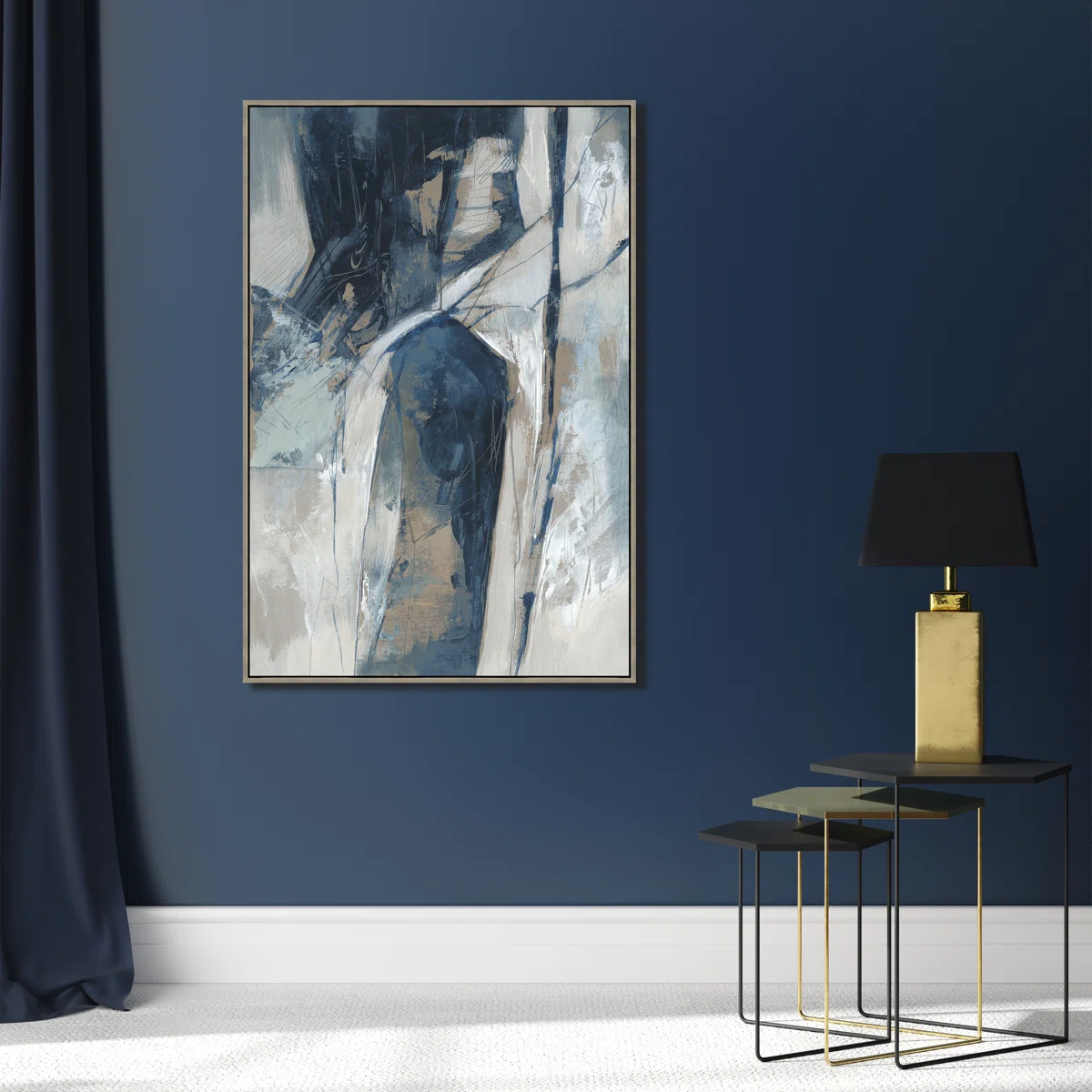 A modern living room with dark blue walls, abstract blue and white painting, black lamp with gold base on stacked black tables, and dark blue curtains. White carpet covers the floor.