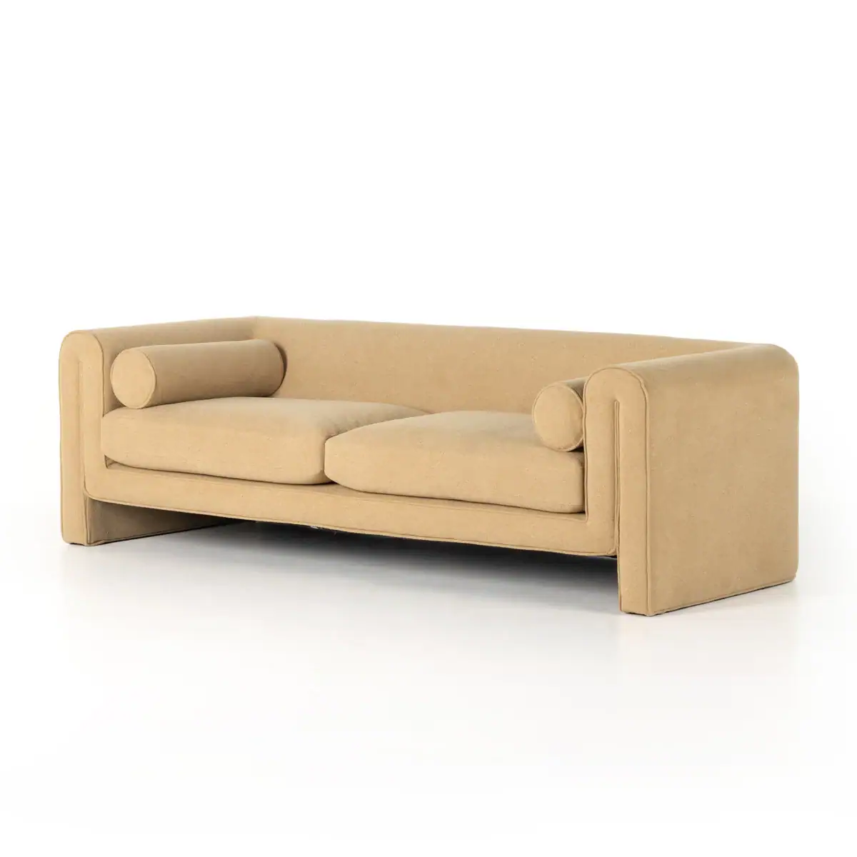 A modern beige sofa with clean lines, two seat cushions, low wide arms, and matching cylindrical bolster pillows on each side, set against a plain white background.