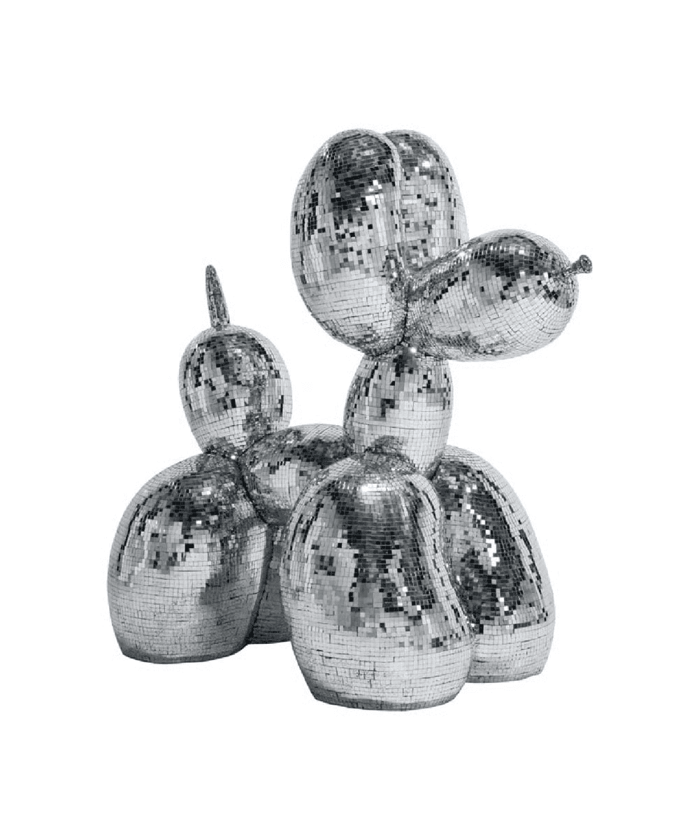 A shiny sculpture of a dog made to look like a balloon animal, covered in small, reflective silver mirror tiles, resembling a disco ball.