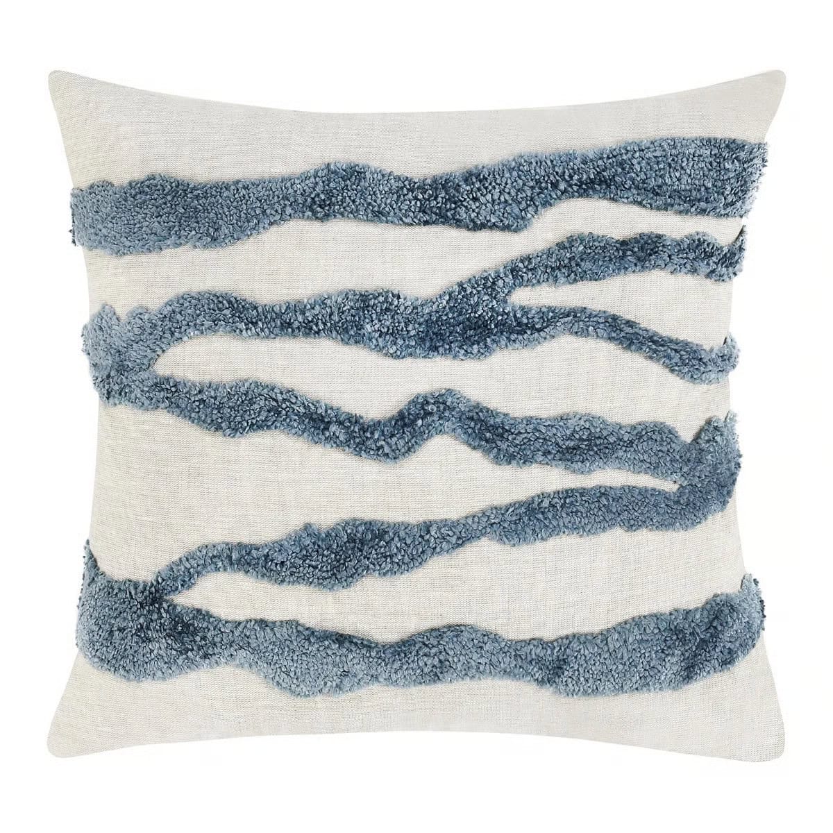 Square decorative pillow with a light beige fabric and four wavy, textured blue lines running horizontally across the front, giving a modern and artistic look.