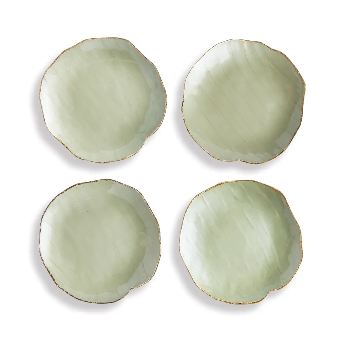 Four light green ceramic plates with uneven, slightly wavy edges and a subtle textured pattern, arranged in a square on a white background.
